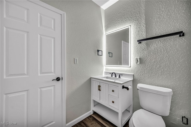 397 Furnace Rd, Conneaut, OH 44030 - bathroom featuring vanity, a textured wall, and wood finished floors