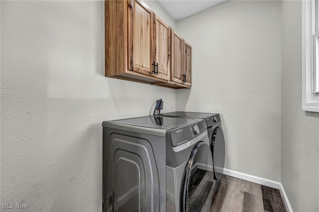 397 Furnace Rd, Conneaut, OH 44030 - washroom featuring cabinet space, independent washer and dryer, and dark wood finished floors