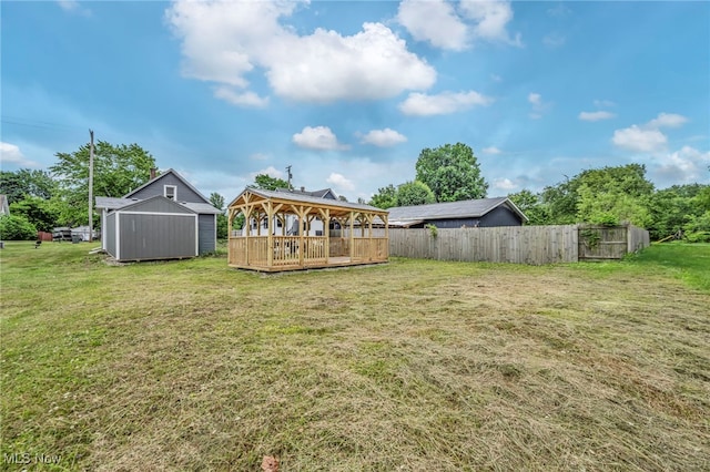 397 Furnace Rd, Conneaut, OH 44030 - view of yard featuring a gazebo, a storage shed, and a wooden deck