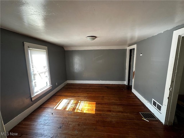 872 Keeney St, Akron, OH 44310 - empty room featuring hardwood / wood-style flooring and baseboards