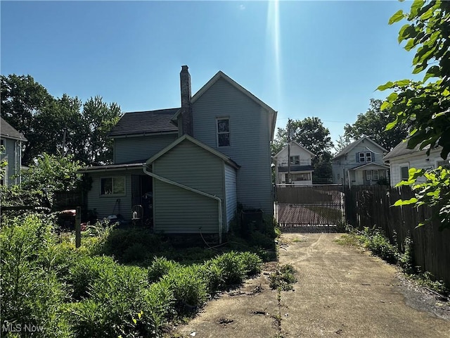 872 Keeney St, Akron, OH 44310 - view of home's exterior featuring a chimney