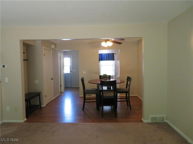 1609 S Main St Unit 22C, North Canton, OH 44709 - carpeted dining room featuring ceiling fan and wood finished floors