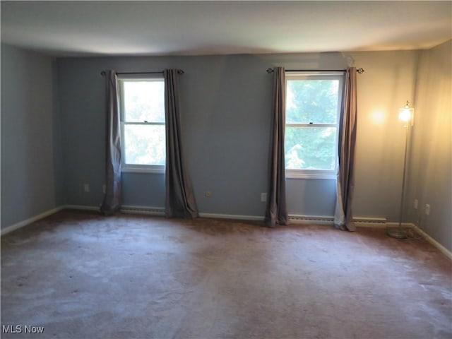 1609 S Main St Unit 22C, North Canton, OH 44709 - empty room with healthy amount of natural light and carpet floors