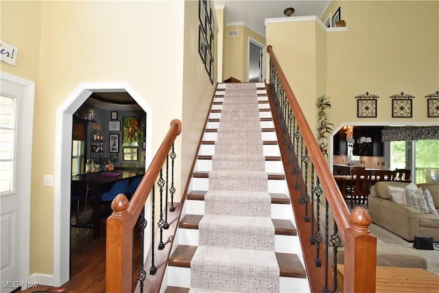 8025 Wadsworth Rd, Wadsworth, OH 44281 - stairs with a towering ceiling, wood finished floors, and a dry bar
