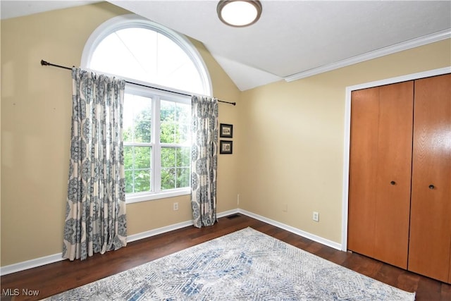 8025 Wadsworth Rd, Wadsworth, OH 44281 - bedroom with lofted ceiling, wood finished floors, a closet, and ornamental molding