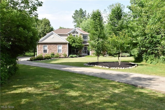8025 Wadsworth Rd, Wadsworth, OH 44281 - craftsman-style home featuring a front yard and stone siding