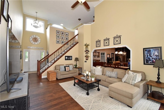 8025 Wadsworth Rd, Wadsworth, OH 44281 - living room with a high ceiling, stairway, a chandelier, ceiling fan, and dark wood-style floors