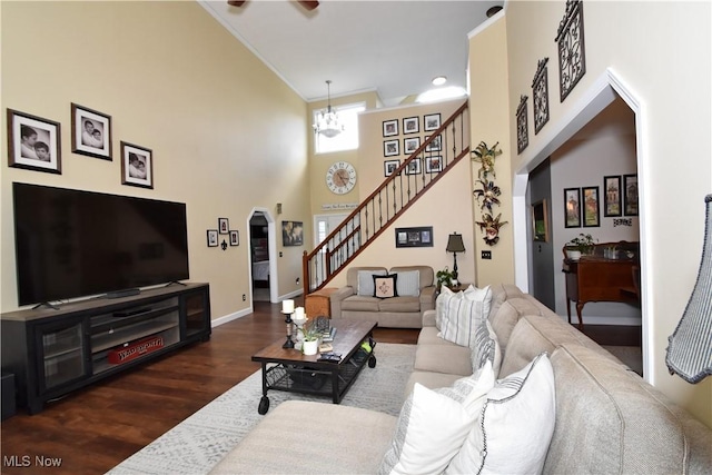8025 Wadsworth Rd, Wadsworth, OH 44281 - living area with stairs, a towering ceiling, wood finished floors, arched walkways, and ceiling fan