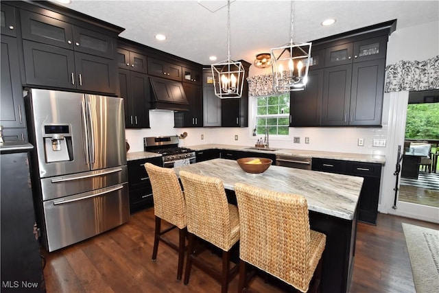 8025 Wadsworth Rd, Wadsworth, OH 44281 - kitchen with appliances with stainless steel finishes, custom range hood, a chandelier, dark wood finished floors, and glass insert cabinets