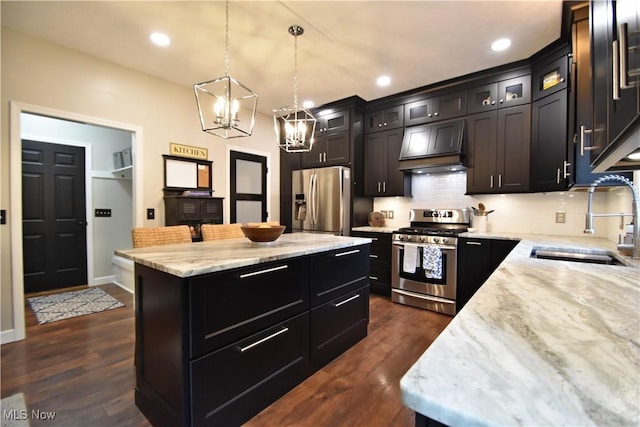 8025 Wadsworth Rd, Wadsworth, OH 44281 - kitchen featuring stainless steel appliances, premium range hood, a center island, decorative backsplash, and a chandelier