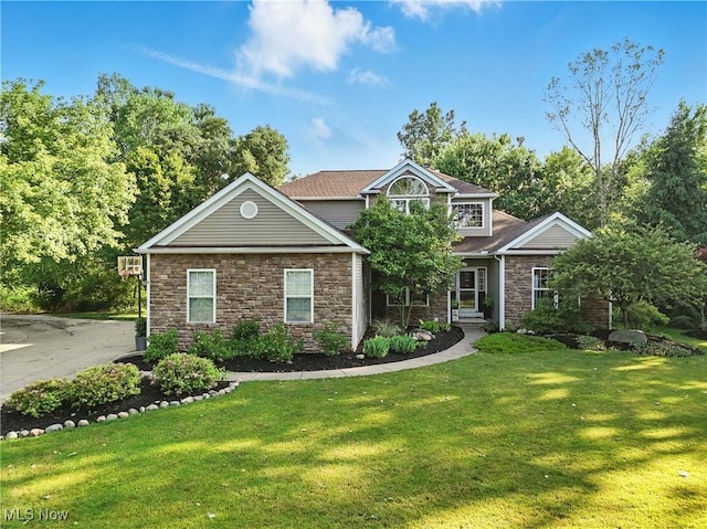 8025 Wadsworth Rd, Wadsworth, OH 44281 - view of front of property with stone siding and a front yard