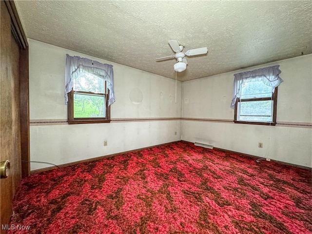 7918 State Route 164, Lisbon, OH 44432 - carpeted empty room featuring a ceiling fan, plenty of natural light, and a textured ceiling