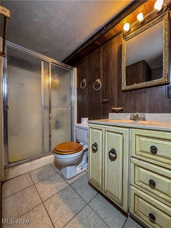 7918 State Route 164, Lisbon, OH 44432 - full bathroom featuring vanity, a shower stall, a textured ceiling, tile patterned flooring, and wood walls