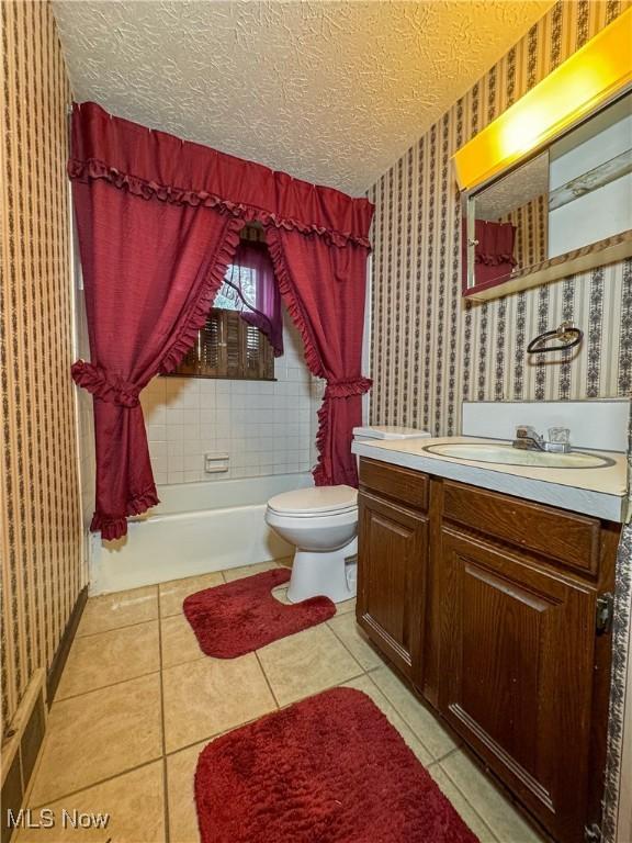 7918 State Route 164, Lisbon, OH 44432 - bathroom featuring wallpapered walls, vanity, tile patterned flooring, and a textured ceiling