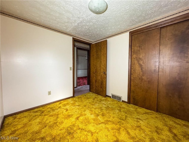 7918 State Route 164, Lisbon, OH 44432 - unfurnished bedroom featuring carpet floors, a textured ceiling, a closet, and crown molding