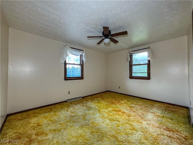 7918 State Route 164, Lisbon, OH 44432 - empty room with a ceiling fan, a textured ceiling, and carpet floors