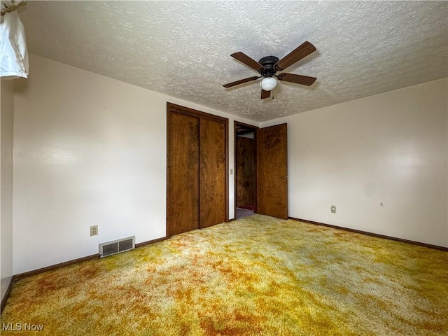 7918 State Route 164, Lisbon, OH 44432 - unfurnished bedroom featuring a textured ceiling, carpet floors, a closet, and ceiling fan