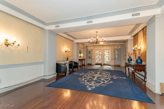 13800 Fairhill Rd Unit 206, Shaker Heights, OH 44120 - entrance foyer featuring a chandelier, wood finished floors, french doors, crown molding, and a baseboard heating unit