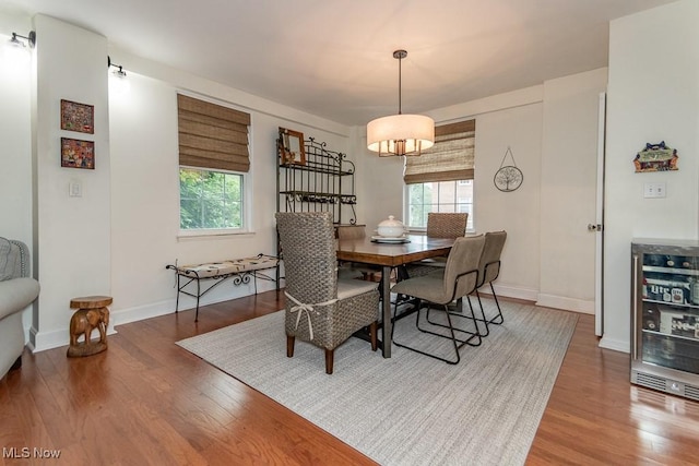 13800 Fairhill Rd Unit 206, Shaker Heights, OH 44120 - dining space featuring wine cooler, wood finished floors, and healthy amount of natural light