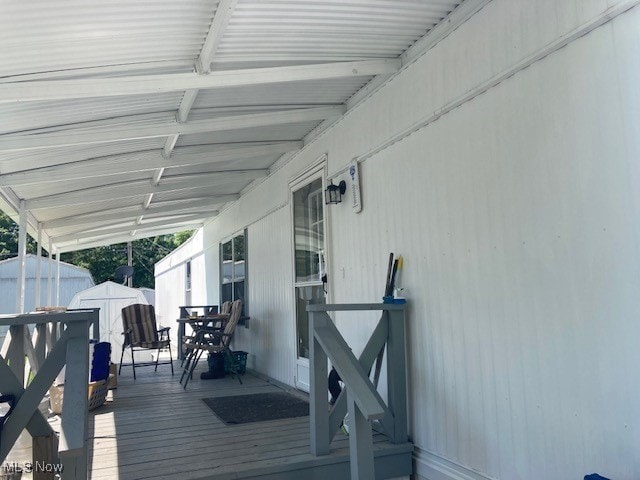 129 Bennett, Vienna, OH 44473 - wooden deck with a shed and outdoor dining area
