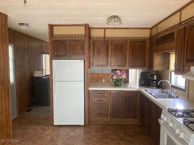 129 Bennett, Vienna, OH 44473 - kitchen featuring white appliances, wood walls, light countertops, ornamental molding, and ventilation hood