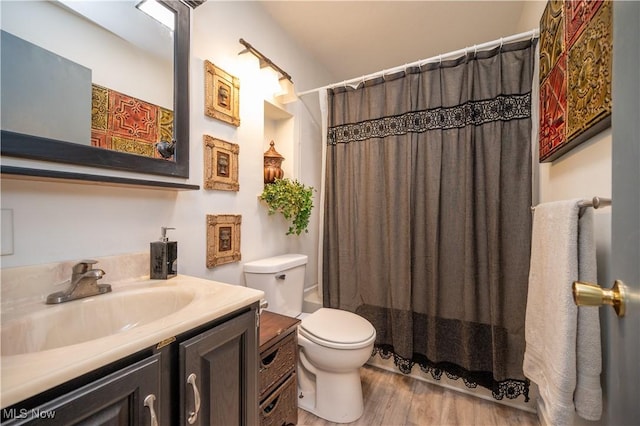1432 Maxwell Ave NW, Warren, OH 44485 - full bathroom featuring vanity, wood finished floors, and curtained shower