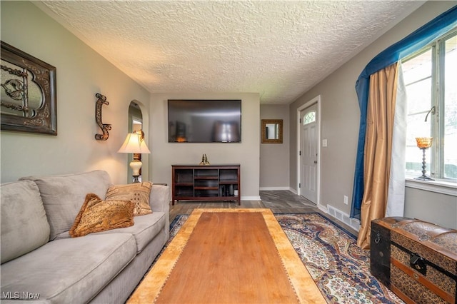 1432 Maxwell Ave NW, Warren, OH 44485 - living room with a textured ceiling and wood finished floors