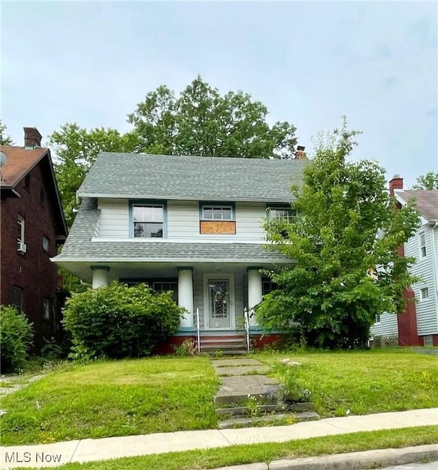 936 Dresden Rd, Cleveland Heights, OH 44112 - view of front facade featuring covered porch, roof with shingles, and a front lawn