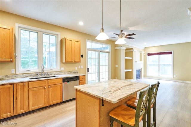 2683 High Hampton Trl, Cuyahoga Falls, OH 44223 - kitchen with stainless steel dishwasher, light wood-style floors, a kitchen island, a breakfast bar area, and recessed lighting