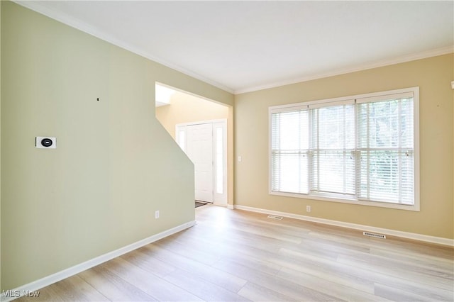 2683 High Hampton Trl, Cuyahoga Falls, OH 44223 - spare room featuring crown molding and light wood-style flooring