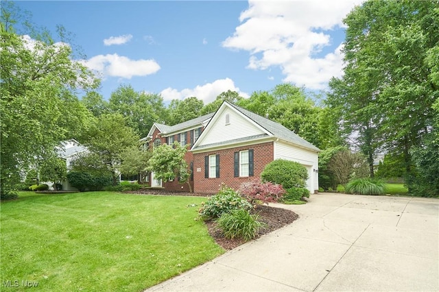 2683 High Hampton Trl, Cuyahoga Falls, OH 44223 - view of front of property featuring driveway, a front lawn, an attached garage, and brick siding