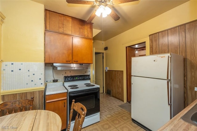 11604 Thornwood Ave, Cleveland, OH 44108 - kitchen with electric range, freestanding refrigerator, under cabinet range hood, a ceiling fan, and light floors