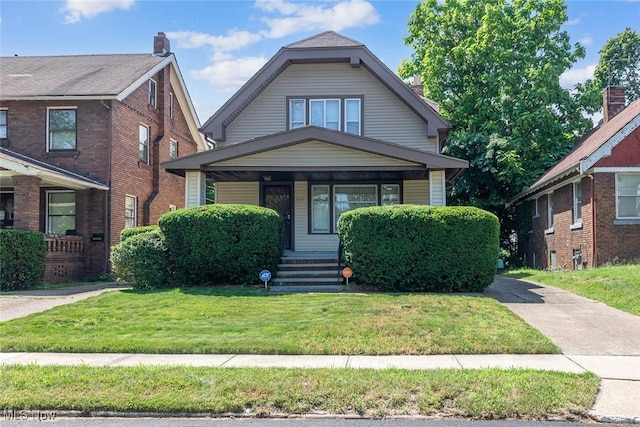 11604 Thornwood Ave, Cleveland, OH 44108 - view of front of home with a porch and a front lawn