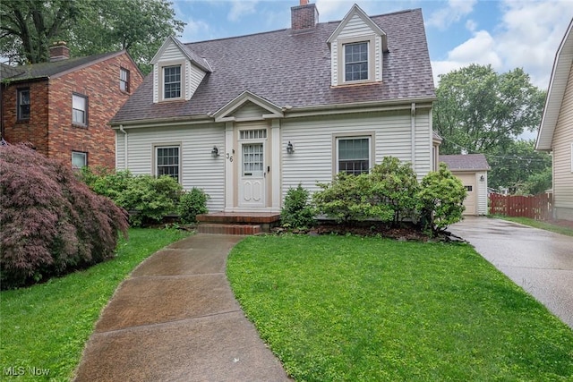 36 Rosedale Blvd, Norwalk, OH 44857 - cape cod house with a shingled roof, a chimney, and a garage