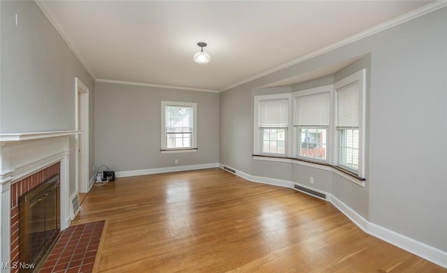 36 Rosedale Blvd, Norwalk, OH 44857 - unfurnished living room featuring wood finished floors, ornamental molding, and a brick fireplace