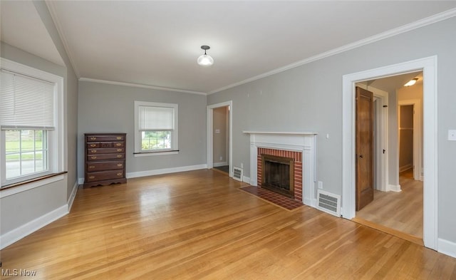 36 Rosedale Blvd, Norwalk, OH 44857 - unfurnished living room with light wood-type flooring, healthy amount of natural light, a fireplace, and ornamental molding