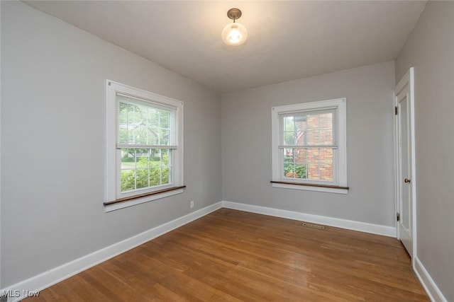 36 Rosedale Blvd, Norwalk, OH 44857 - empty room featuring healthy amount of natural light and wood finished floors