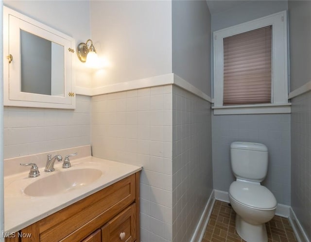 36 Rosedale Blvd, Norwalk, OH 44857 - half bath with tile walls, vanity, and a wainscoted wall