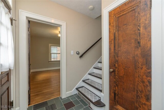 36 Rosedale Blvd, Norwalk, OH 44857 - stairway with baseboards and tile patterned floors