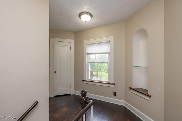 36 Rosedale Blvd, Norwalk, OH 44857 - hall with dark wood-style floors and a textured ceiling