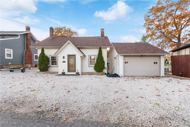 3568 Peninsula Dr, Coventry, OH 44319 - view of front of property featuring a garage and a chimney