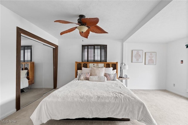 3568 Peninsula Dr, Coventry, OH 44319 - bedroom with light colored carpet, a ceiling fan, and a closet