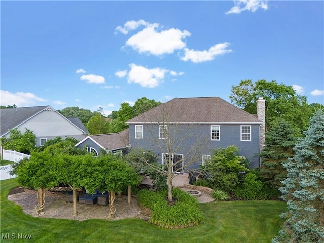 905 Braemar Cir, North Canton, OH 44720 - back of house with a lawn and a chimney