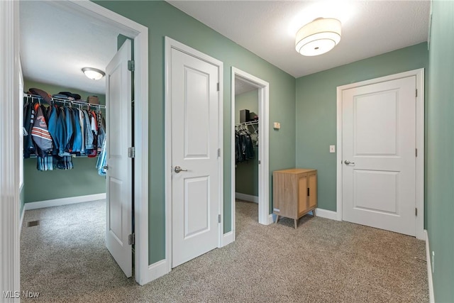 905 Braemar Cir, North Canton, OH 44720 - hall featuring light carpet and baseboards