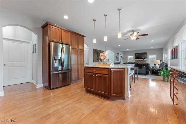 905 Braemar Cir, North Canton, OH 44720 - kitchen featuring stainless steel refrigerator with ice dispenser, arched walkways, a ceiling fan, light wood finished floors, and recessed lighting