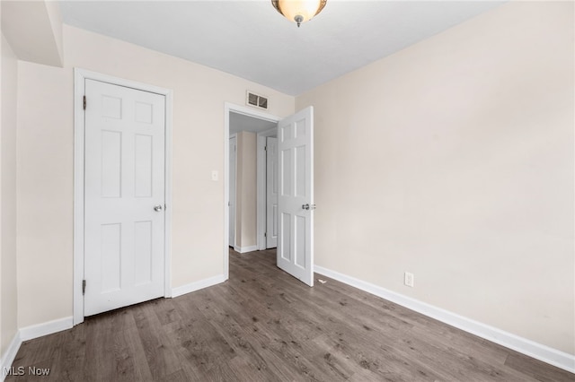 907 Hillsdale Ave, Parma, OH 44134 - unfurnished bedroom with wood finished floors and baseboards