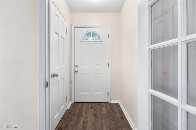 907 Hillsdale Ave, Parma, OH 44134 - doorway to outside featuring baseboards and dark wood finished floors