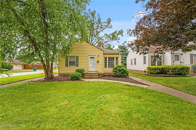 907 Hillsdale Ave, Parma, OH 44134 - bungalow-style home with a chimney and a front lawn