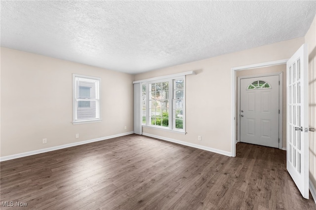 907 Hillsdale Ave, Parma, OH 44134 - entryway with dark wood-style floors and a textured ceiling