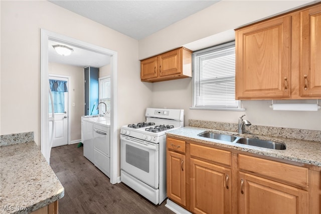 907 Hillsdale Ave, Parma, OH 44134 - kitchen featuring white range with gas cooktop, dark wood finished floors, and light stone countertops